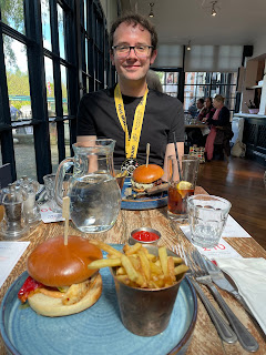 John posing in front of our burgers we got after the race.