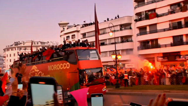 Fans take pictures during a homecoming parade for Morocco's national football team in central Rabat.