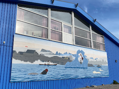 Mural on blue building in Nanortalik