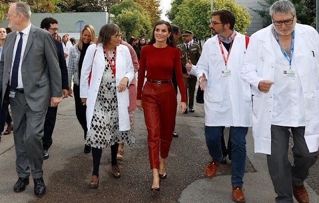 Queen Letizia wore a red frankie cuff detail wool sweater by Hugo Boss. Hugo Boss red leather trousers