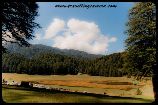 HPPWD Guest House @ Mini Switzerland of Himachal Pradesh, INDIA : Posted by VJ Sharma @ www.travellingcamera.com : Khajjiar in Chamba District of Himachal Pradesh is known as mini Switzerland of India. Its a beautiful place between Deodar Forests.. A lake on hill top with a splendid view of snow capped hills looks amazing... Khajjiar is just 25 kilometers from Dalhousie and one must go here if planned for Dalhousie or Chamba...A view of Khajjiar Lake from HPPWD Guest House.... For more details about Khajjiar, check out http://hpchamba.nic.in/destkhajjiar.htm Another photograph of Mini Switzerland from HPPWD guest house...HPPWD Guest House @ Khajjiar, Chamba, Himachal Pradesh...Its situated on one edge of Khajjiar Lake and gives amazing view of lake... All the photographs of Khajjiar lake shared in this post have been clicked form this guest House...CLICK on below mentioned links to see more photographs of Dalhousie region in Himachal Pradesh.... Click Here to see snowfall photographs in Dalhousie: My first Rendevous with SnowClick Here to see colorful birds @ Dalhousie ChurchClick here to feel Dalhousie An inetersting and one of the best Hill stations in Himachal PradeshClick here to see Photographs of Mesmerizing Khajjiar Click Here to see beautiful Ravi River near Dalhousie @ Chamba, Himachal Pradesh Click Here to see photographs of Colorful ChambaClick here to see Snow-Covered Peaks of Peer-Panjal Range @ Himachal PradeshClick Here to see Sunset @ Dalhousie, Himachal Pradesh