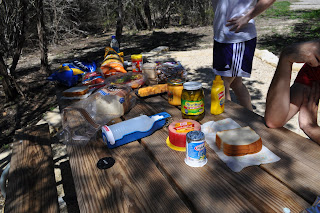 Picnic table full of all our food, we brought sandwich stuff, chips, fruits and cheese cubes lol. You can see Darrell's elbow leaning on the table and my friend Shelly standing in the background - well the bottom of her white shirt and her purple shorts.