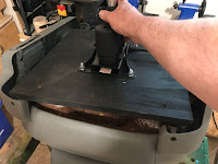 Putting the assembly on the bottom of the seat