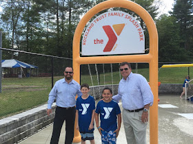 Hockomock Area YMCA Board of Directors Vice Chairman Bill Chouinard (far left) and Hockomock Area YMCA Board of Directors Chairman Brian Earley (far right) with YMCA members Aiden Cohen (second from left) and Ryan Martin (third from left)