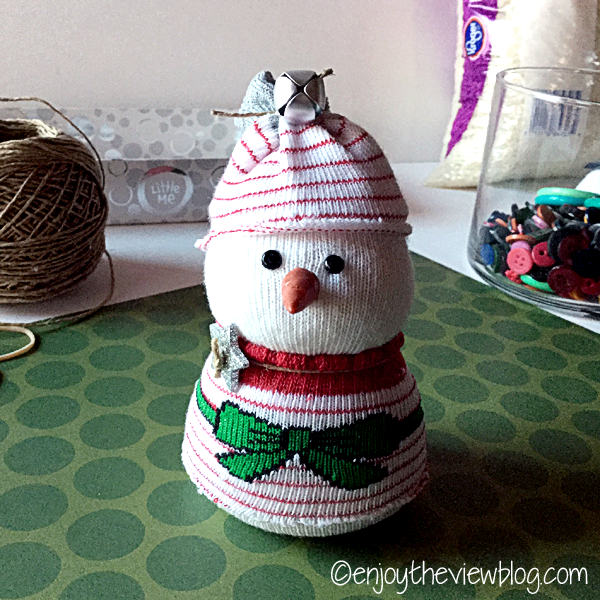 snowbaby "dressed" using a holiday baby sock