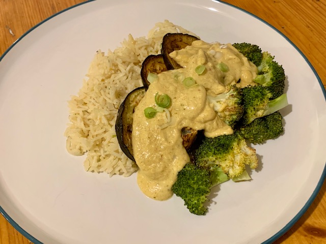 Aubergine satay with rice and broccoli