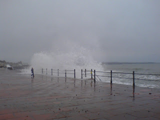 Large wave crashing over railings on Penzance promenade