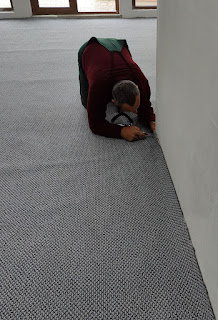 Bekir trims down the carpet