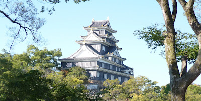 Okayama Castle through trees as seen from the Korakuen Garden, Okayama