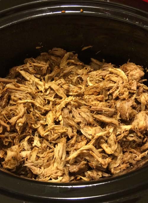 Root Beer Pulled Pork Shredded and Ready for Further Slow Cooking with BBQ Sauce