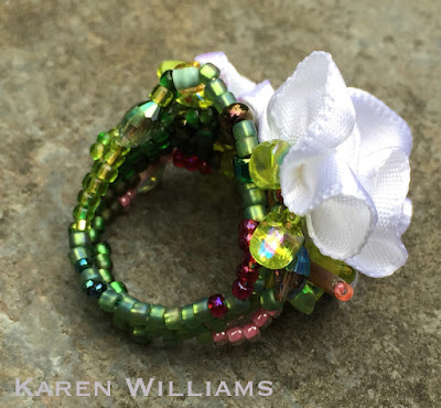 alternate side view of Karen Williams' Apple Blossom freeform peyote ring