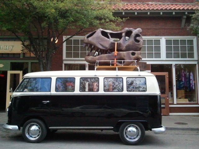 And now for a picture of a VW Bus with a Dinosaur Head strapped onto the