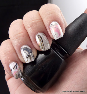 Pink, white and black water marble effect mani