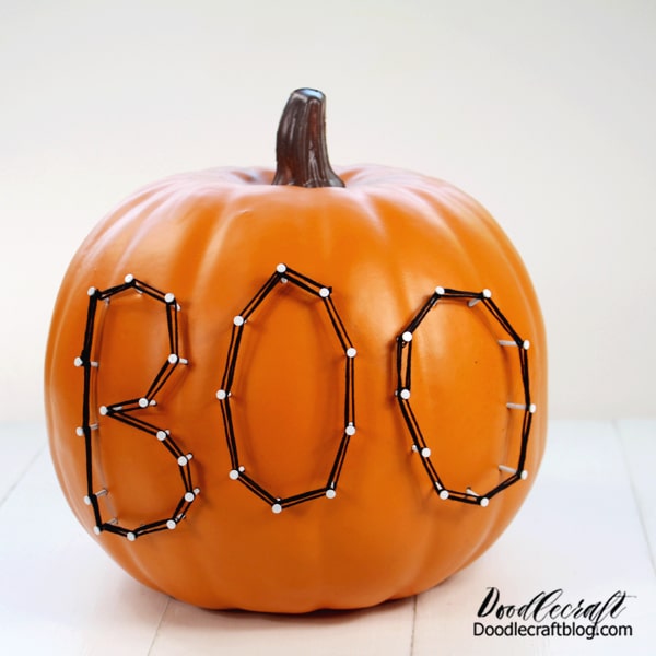 This is all! Put it in a rustic stack of books for the perfect Halloween decoration. Oriental Trading has black squash, white gourd and even turquoise that would look great in yarn art.