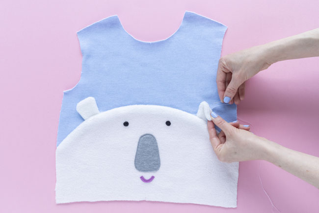 Hand sewing polar bear face sweatshirt bodice