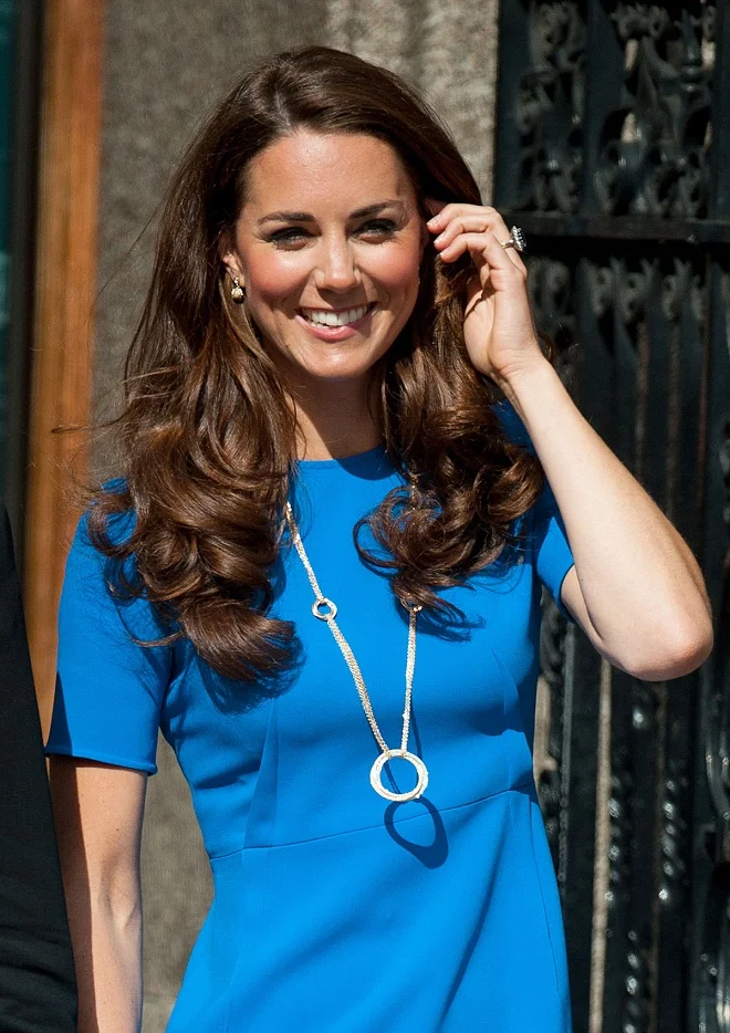 Kate Middleton wears an Olympic themed necklace with a Stella McCartney dress