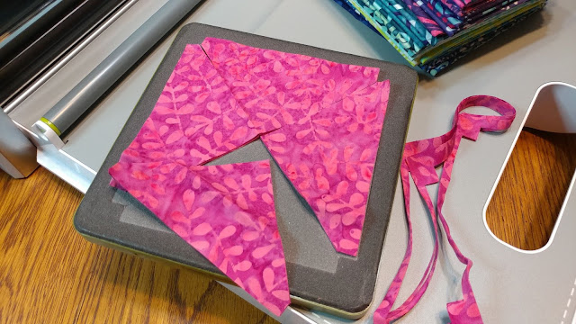 Cutting quarter square triangles with an AccuQuilt cutter