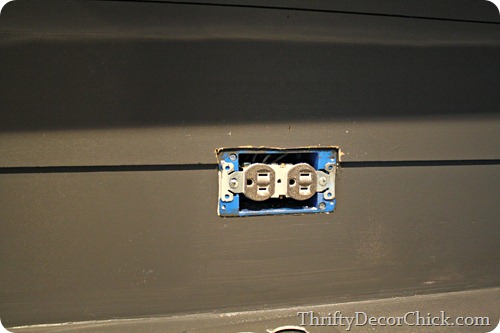 cutting wood around outlet