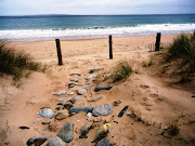 Walking the long stretches of golden sand on the beach at Dugort .