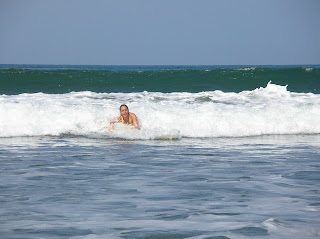 Molly riding waves in Costa Rica