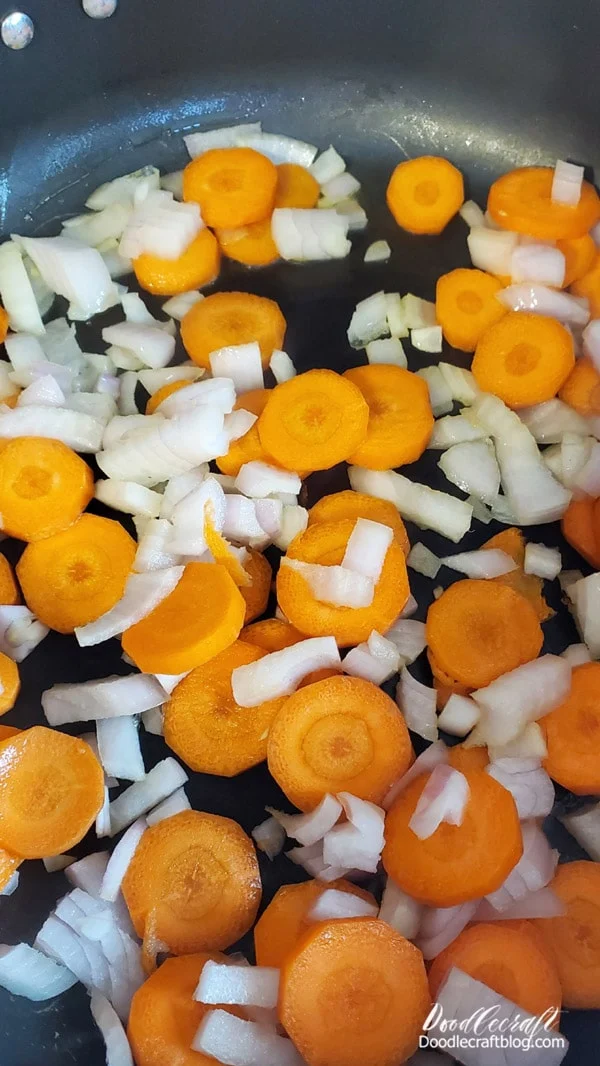 Step 1: Sautee Veggies  Begin by chopping up the onion and carrots and throw them in a skillet with a little olive oil.   Let that begin to cook and simmer while you cut up the chicken breast.