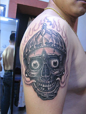 skull tattoo arm. skull tattoo on the arm