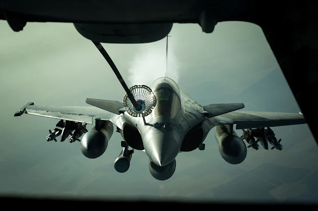 FILE PHOTO: A French Dassault Rafale jet receives fuel from a U.S. Air Force KC-10 tanker aircraft near Iraq October 26, 2016. U.S. Air Force/Senior Airman Tyler Woodward/Handout via REUTERS/File Photo