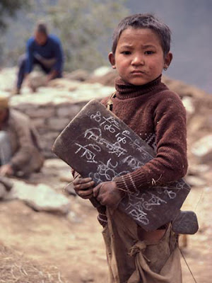 Sherpa child with writing tablet. 