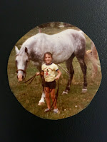 Nicole Rovig leading a horse as a child