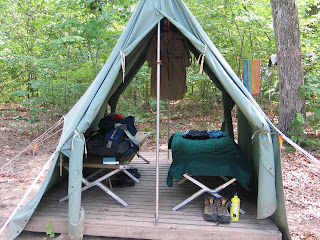 Standard camp canvas tent on wooden platform