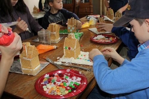 Decorating gingerbread houses with homeschool friends