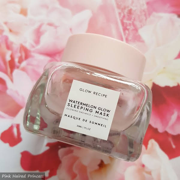 glass jar of watermelon sleep mask on pink floral background