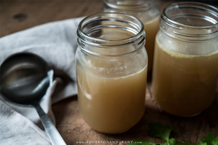 Three jars of homemade chicken stock