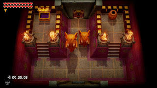 A Chamber with two Elephant Statues and an open chest in front of the Nightmare's Lair.