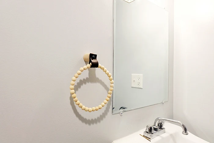 dollar store decor diy beaded towel ring installed on wall