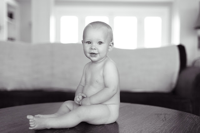 At 9-months old, he loves peek-a-boo and playful noises.   Taken as part of Baby's First Year Package, this 9-month mini session offers 3 digital images in a single pose.