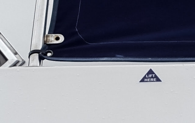 Photo of one of the new "Lift here" stickers