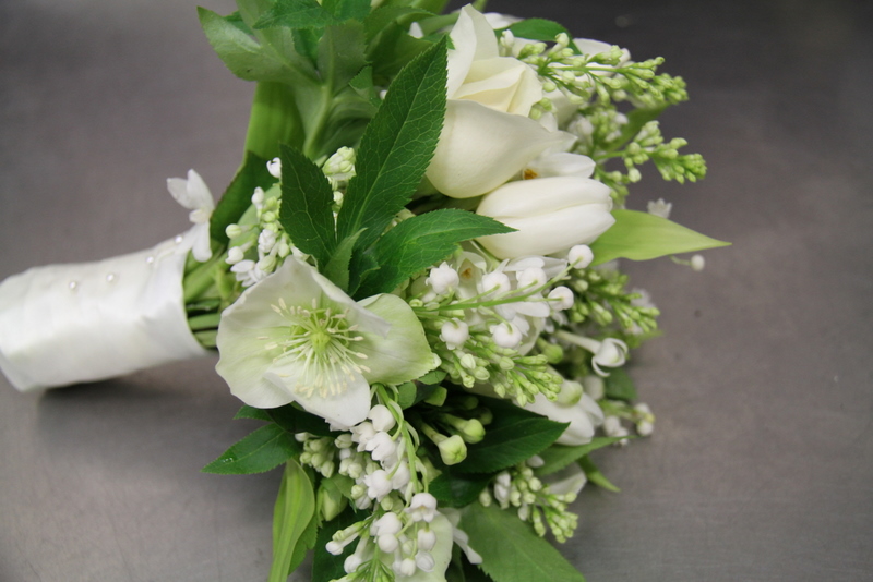 I adore this wedding bouquet of all white winter blooms it's light and