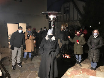 Group of people outdoors, masked