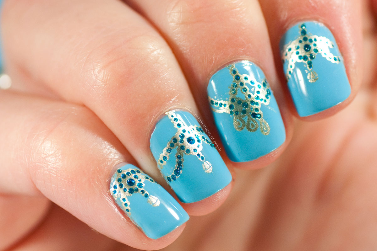 Blue Ornamental Nails stamped with MoYou London Explorer Plate 21