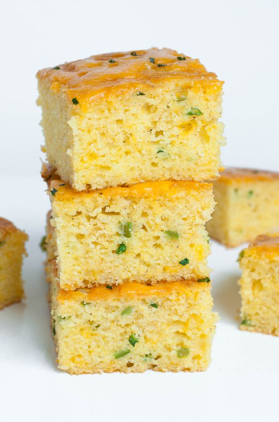 Fantastically fluffy Jalapeño Cheddar Cornbread FTW! This crazy good cornbread gets a leg up from two classic mix-ins: ooey gooey cheddar cheese and fiery jalapeño. The result is a kiss of heat blanketed by cheesy cornbread goodness.