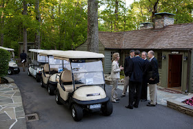 President Obama outside Aspen Lodge at Camp David - with golf carts 