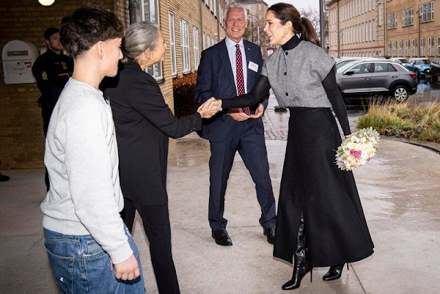 Crown Princess Mary wore a gray vest by MKDT Mark Kenly Domino Tan. The Princess wore a black turtleneck sweater