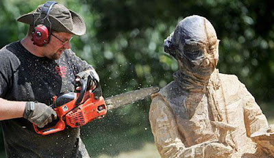 Using chainsaw to sculpt wood