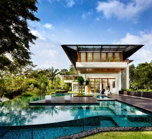 Tropical modern home design by Guz Architects