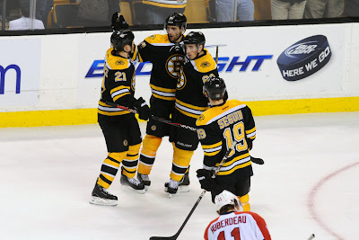 Bruins players celebrate a goal