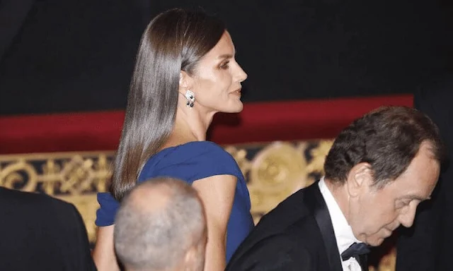 Queen Letizia wore a her Carolina Herrera royal blue maxi gown. Jimmy Choo gold leather sandals. Magrit gold clutch