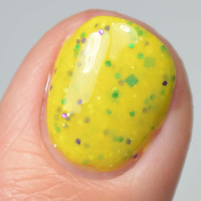 yellow glitter nail polish close up swatch