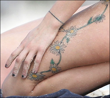 flower tattoos on wrist. Peaches Geldof Tattoos
