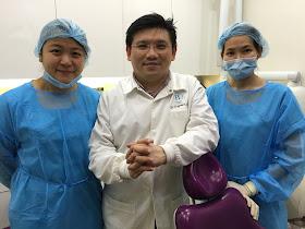 B9 dental ; Dr Raymond Lim with his friendly staff